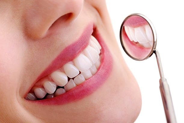 Beautiful smiling model with dental mirror- XXXL Image